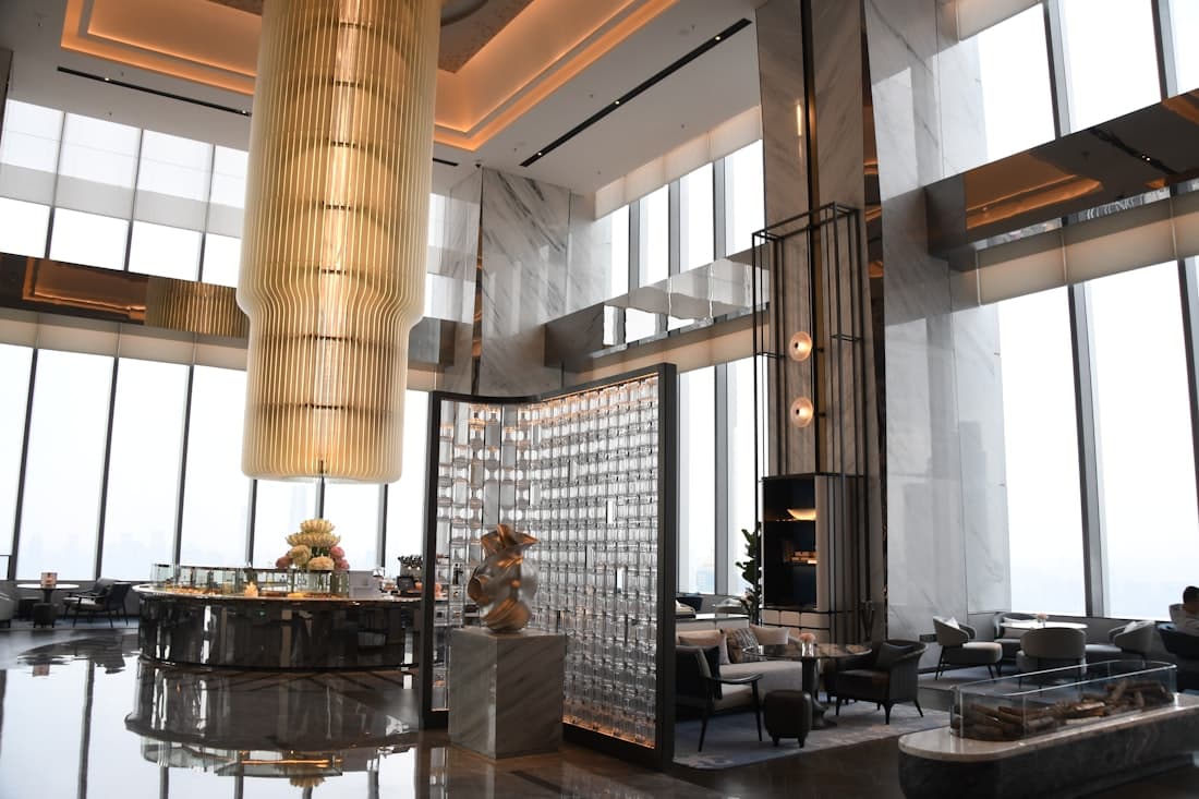 Light-filled marble lounge with full-height windows